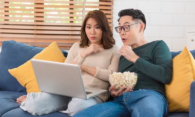 happy couple watching in shock
