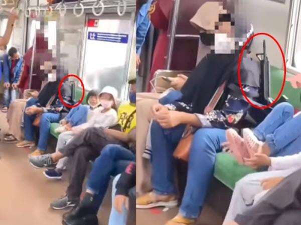 Wadaw! Viral Emak-Emak Bawa 'Senjata Assault Rifle' di Dalam KRL, Duduk Santai Banget