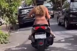 Viral! Bule Berambut Pirang Ini Lakukan Twerking di Atas Motor, Netizen: Menjijikkan
